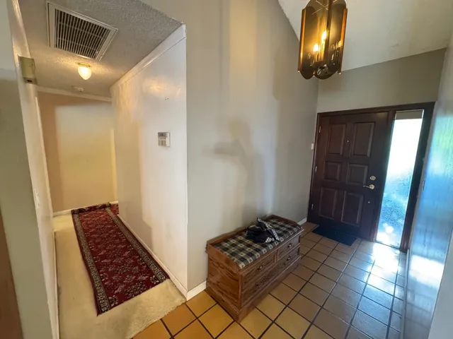 a view of a entryway door with wooden floor