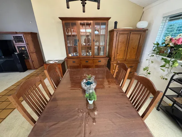 a view of living room kitchen and entryway