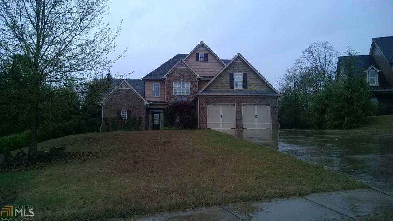 9 Outpost Southeast Rome, GA 30161 - Photo 1 of 1 a front view of a house with a yard and garage