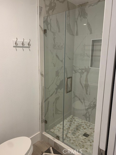 2275 Hazel Road Tustin, CA 92780 - Photo 11 of 25 a bathroom with a shower and toilet