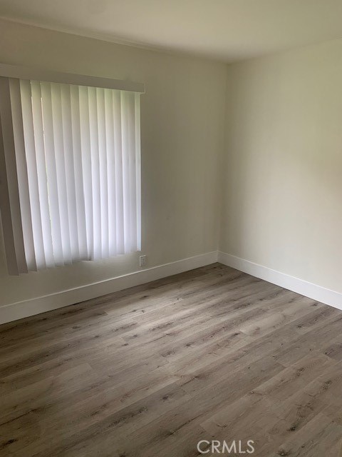 2275 Hazel Road Tustin, CA 92780 - Photo 12 of 25 a view of empty room with wooden floor and fan
