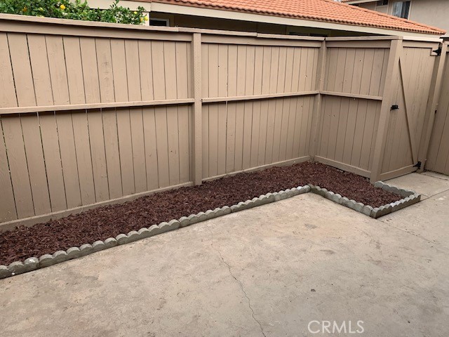 2275 Hazel Road Tustin, CA 92780 - Photo 18 of 25 a view of a backyard with wooden fence