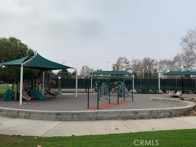 2275 Hazel Road Tustin, CA 92780 - Photo 20 of 25 an outdoor space with lots of trees in the background