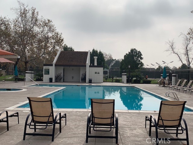 2275 Hazel Road Tustin, CA 92780 - Photo 23 of 25 a swimming pool with outdoor seating and yard