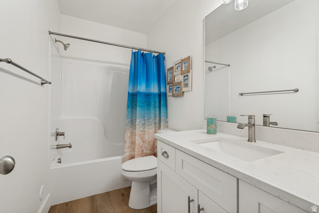 683 Kings Landing Tooele, UT 84074 - Photo 28 of 39 Bathroom with a white vanity featuring a rectangular undermount sink and a light-toned countertop