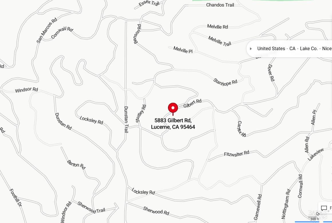 a white and white wall with a vase of flowers