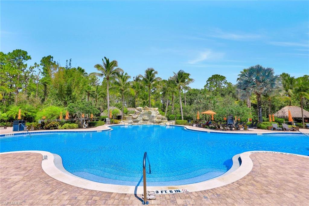 9115 Capistrano Street South, Unit 8207 Naples, FL 34113 - Photo 19 of 29 a view of a swimming pool with a patio