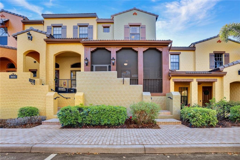 9115 Capistrano Street South, Unit 8207 Naples, FL 34113 - Photo 2 of 29 front view of a brick house
