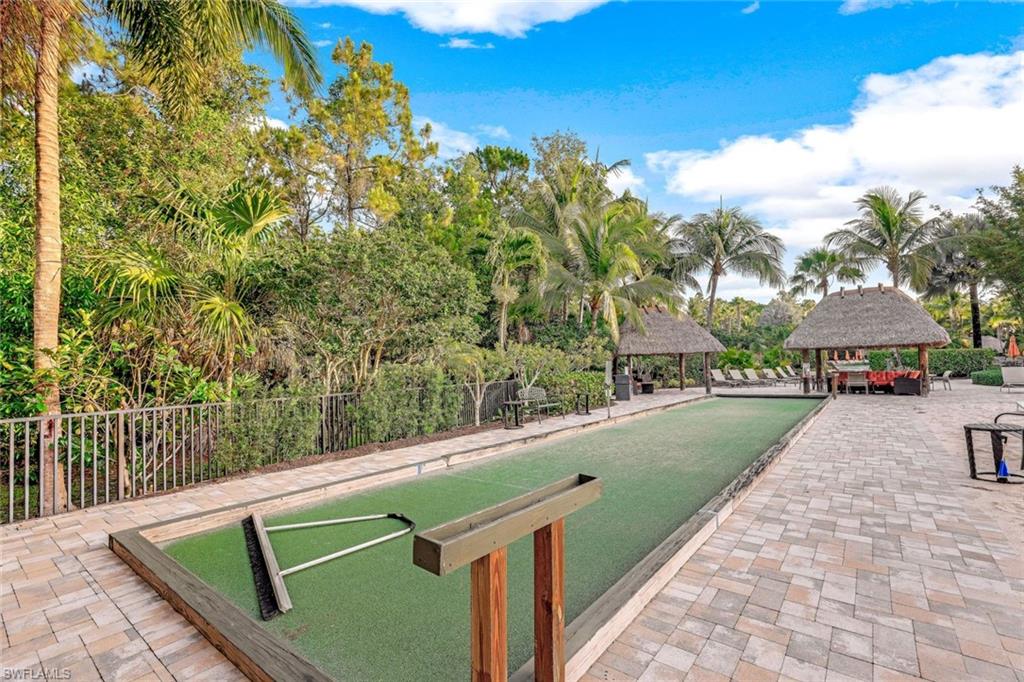 9115 Capistrano Street South, Unit 8207 Naples, FL 34113 - Photo 24 of 29 a view of swimming pool with a yard