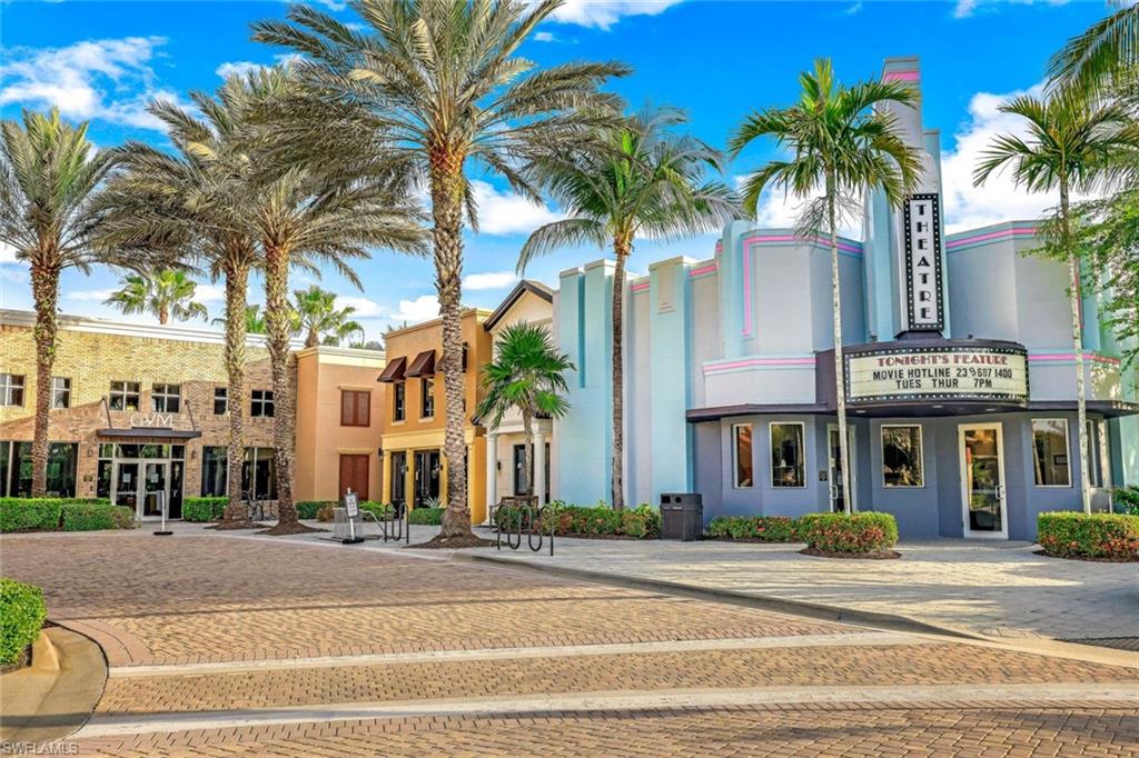 9115 Capistrano Street South, Unit 8207 Naples, FL 34113 - Photo 26 of 29 a view of a building with a palm tree