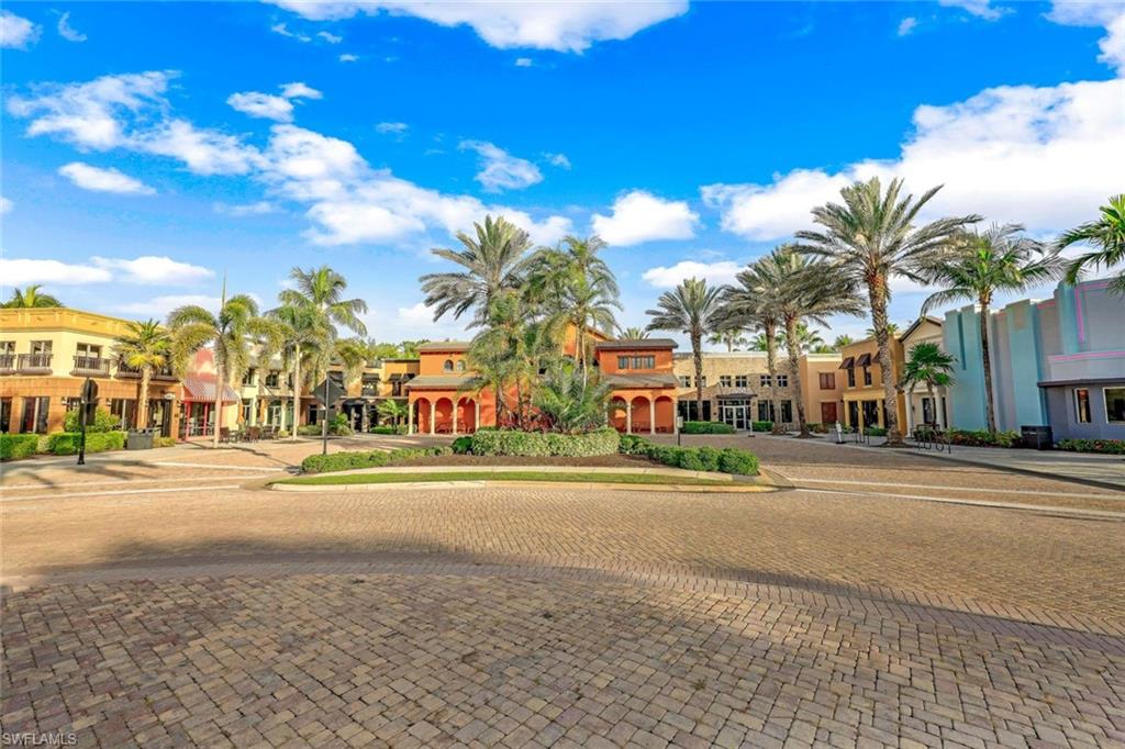 9115 Capistrano Street South, Unit 8207 Naples, FL 34113 - Photo 27 of 29 a city view with large trees