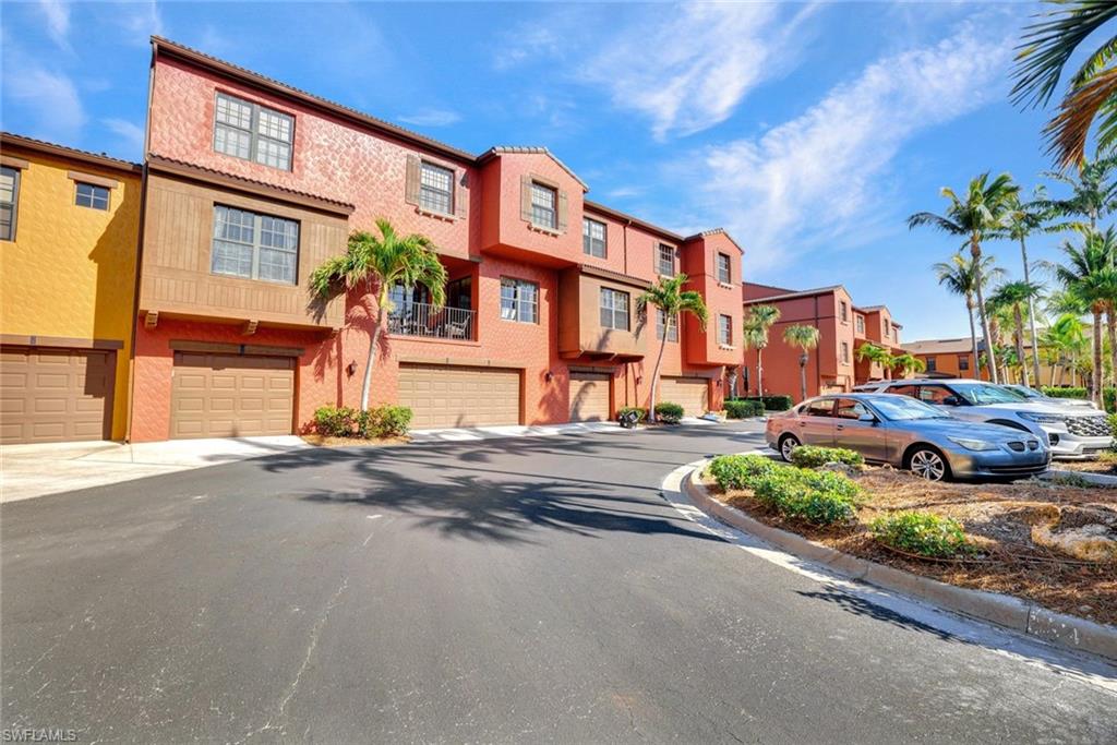 9115 Capistrano Street South, Unit 8207 Naples, FL 34113 - Photo 29 of 29 a front view of a building with street view