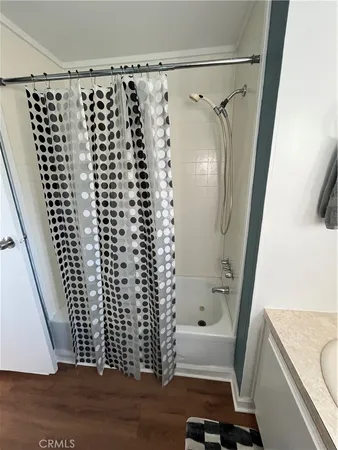 a bathroom with a bathtub and shower