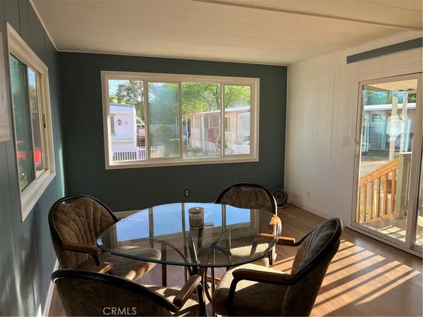 a view of a dining room with tables and chairs