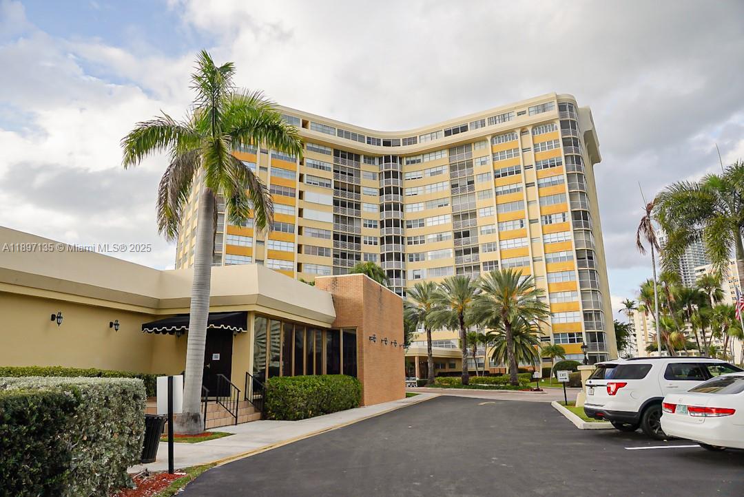 100 Golden Isles Drive, Unit 10 Hallandale Beach, FL 33009 - Photo 1 of 18 a view of multiple houses with a street