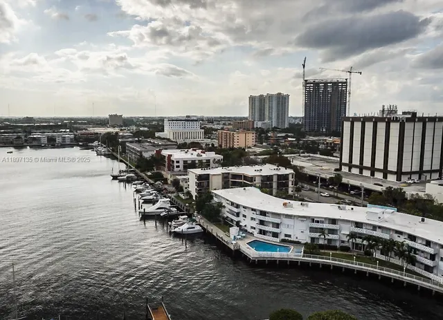 a view of a lake with tall buildings