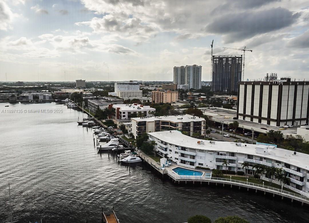 100 Golden Isles Drive, Unit 10 Hallandale Beach, FL 33009 - Photo 4 of 18 a view of a lake with tall buildings