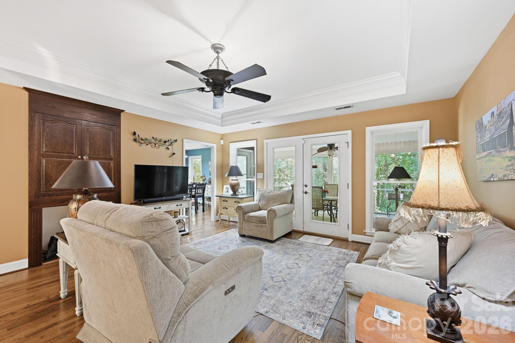 145 Upper Spencer Mountain Road Stanley, NC 28164 - Photo 8 of 29 a living room with furniture and a flat screen tv