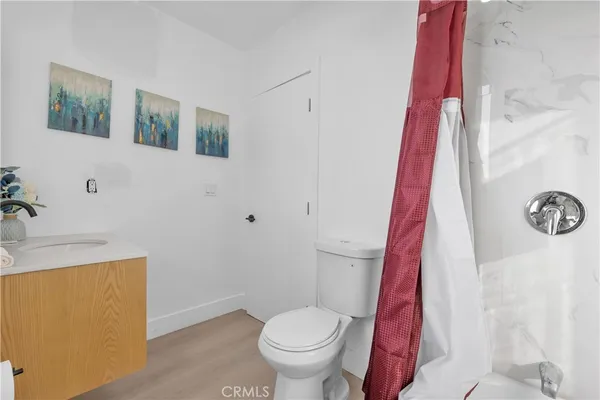 a white toilet sitting next to a bathroom sink