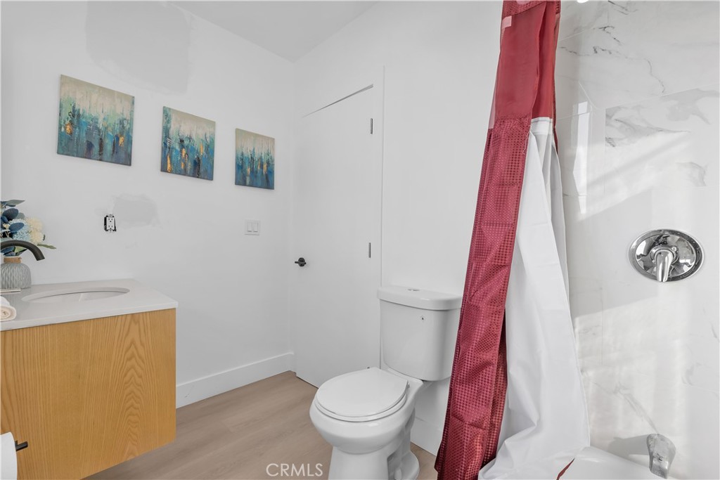 3115 Arvia Street, Unit 1B Los Angeles, CA 90065 - Photo 16 of 27 a white toilet sitting next to a bathroom sink