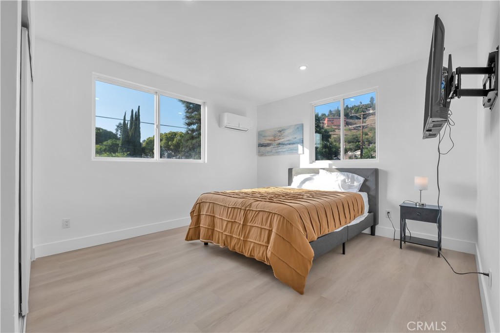 3115 Arvia Street, Unit 1B Los Angeles, CA 90065 - Photo 7 of 27 a bedroom with a bed and large window