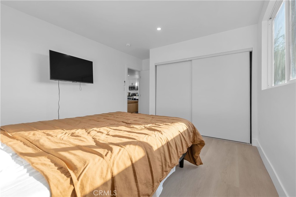 3115 Arvia Street, Unit 1B Los Angeles, CA 90065 - Photo 8 of 27 a bedroom with a bed and a flat screen tv