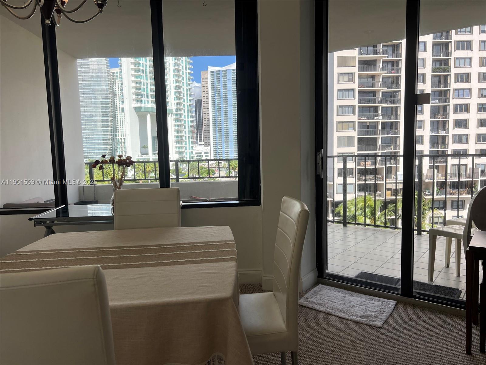 520 Brickell Key Drive, Unit A900 Miami, FL 33131 - Photo 13 of 58 a living room with furniture and a window