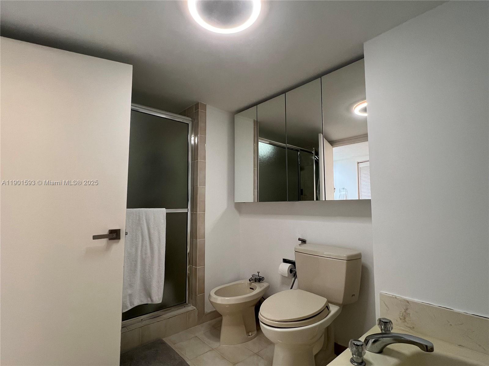520 Brickell Key Drive, Unit A900 Miami, FL 33131 - Photo 22 of 58 a bathroom with a toilet and a shower