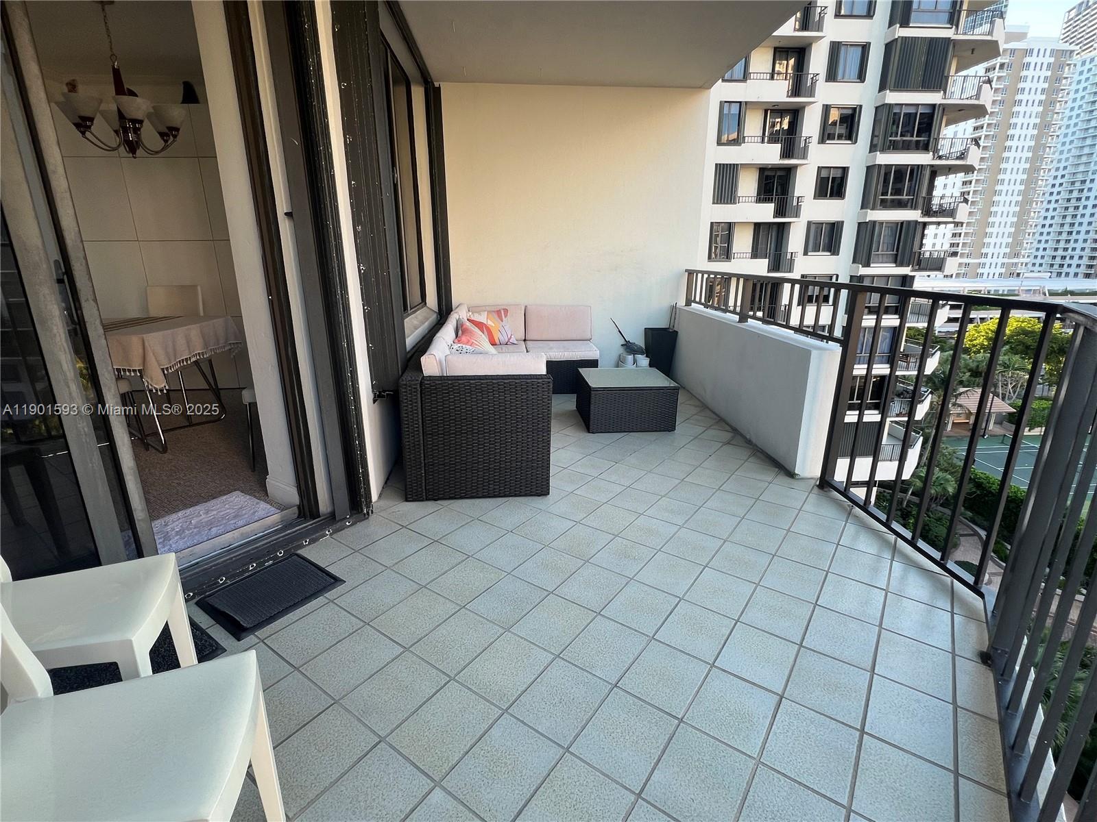 520 Brickell Key Drive, Unit A900 Miami, FL 33131 - Photo 30 of 58 a view of a balcony with chair and door