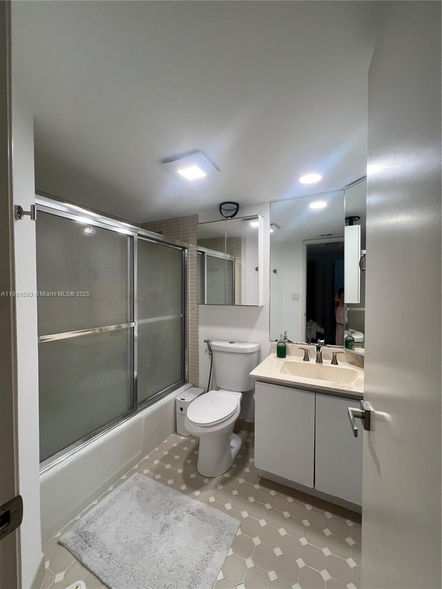 520 Brickell Key Drive, Unit A900 Miami, FL 33131 - Photo 31 of 58 a bathroom with a sink toilet and shower