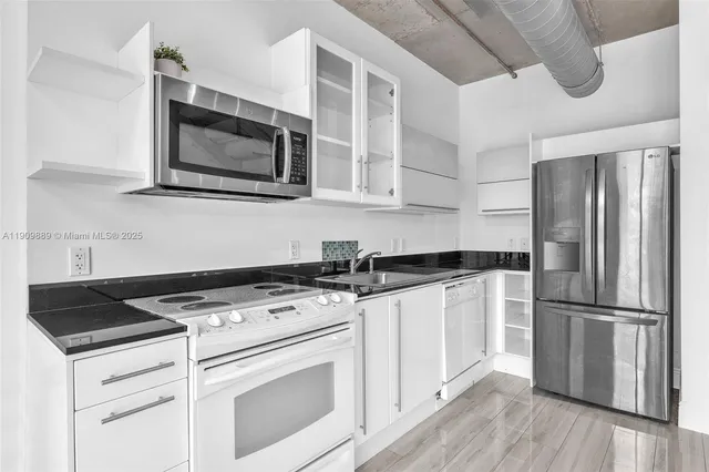a kitchen with a stove microwave and refrigerator