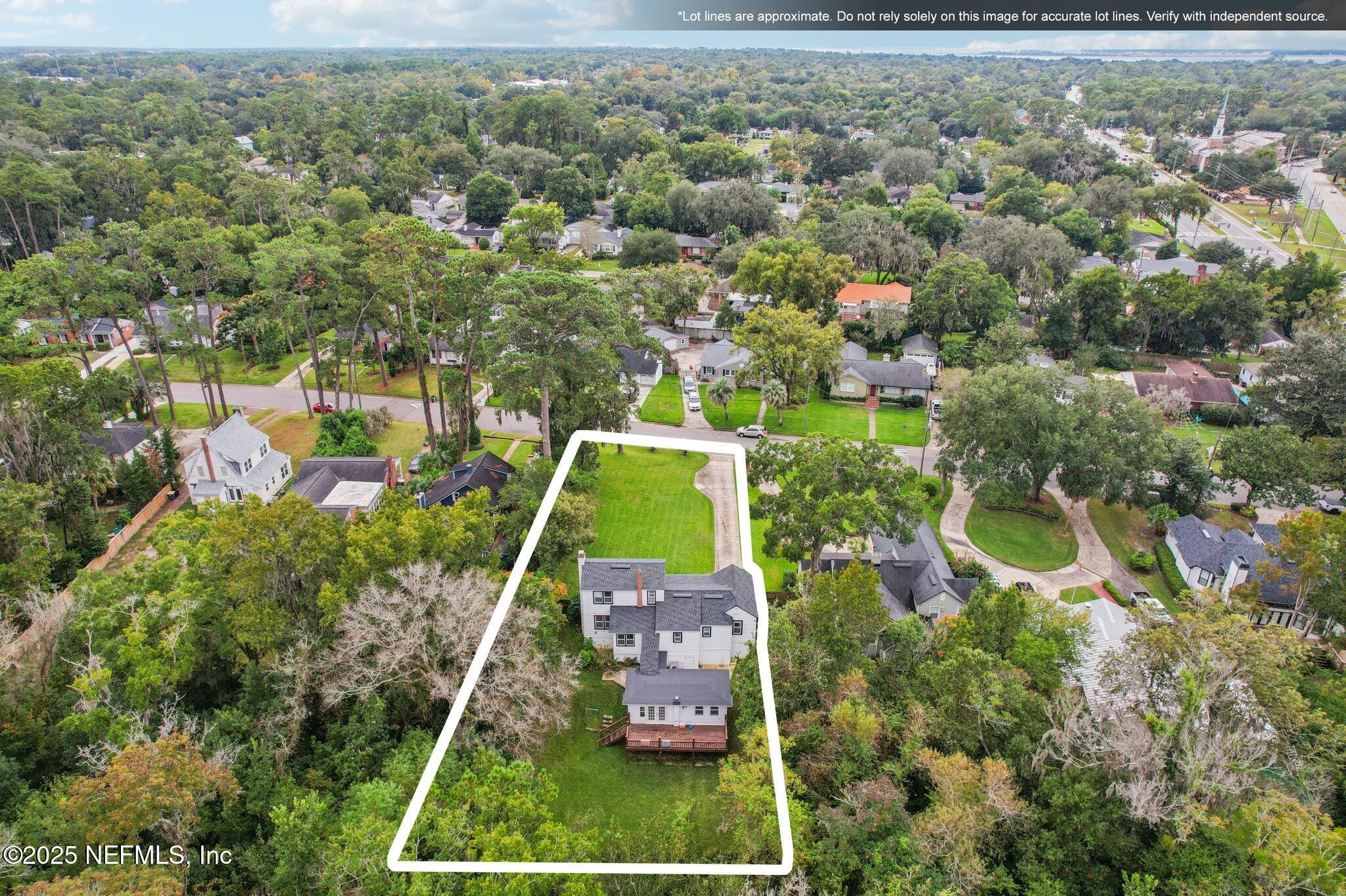 1605 Lorimier Road Jacksonville, FL 32207 - Photo 12 of 57 an aerial view of a house with a yard and lake view