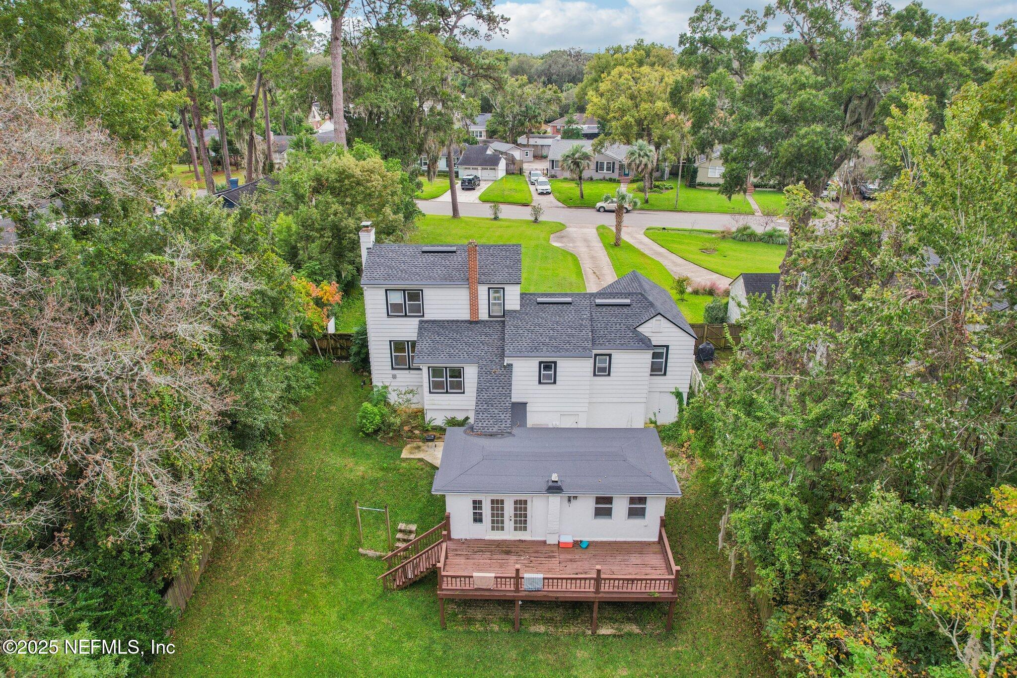 1605 Lorimier Road Jacksonville, FL 32207 - Photo 13 of 57 an aerial view of a house with a swimming pool and a yard