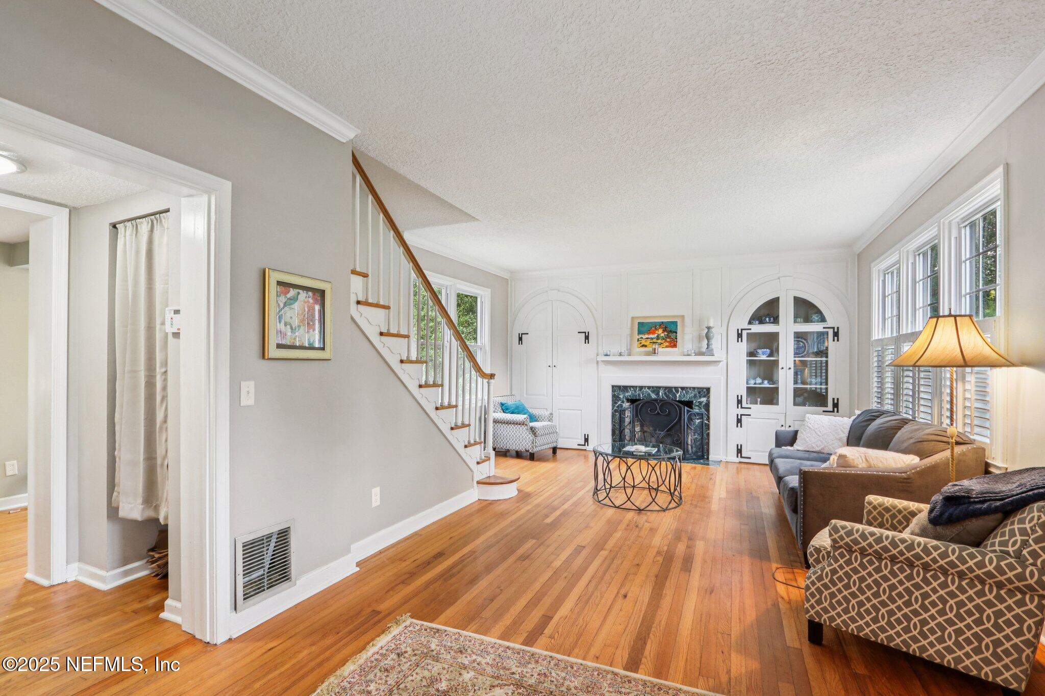 1605 Lorimier Road Jacksonville, FL 32207 - Photo 21 of 57 a living room with furniture fireplace and a large window