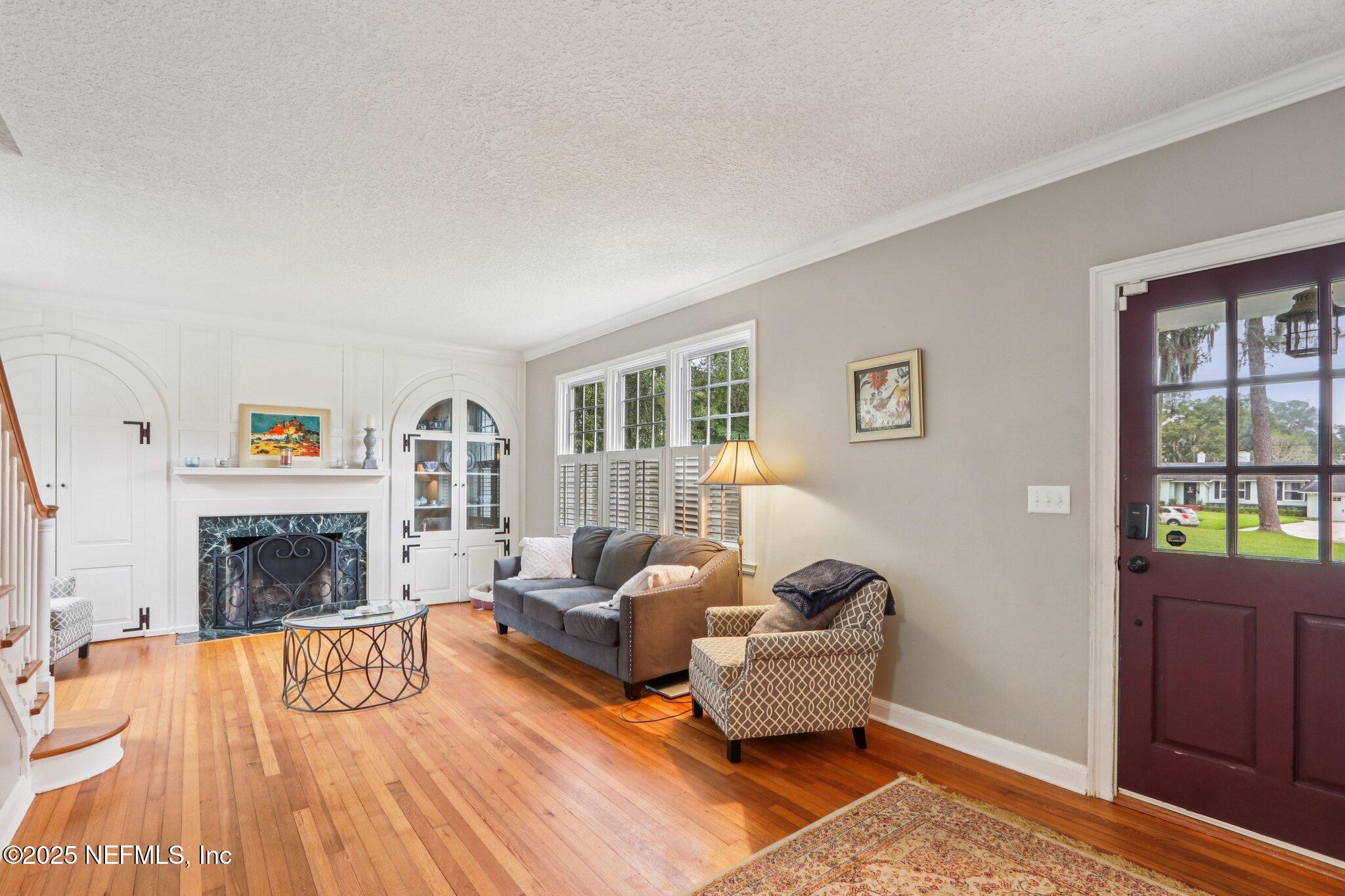 1605 Lorimier Road Jacksonville, FL 32207 - Photo 22 of 57 a living room with furniture and a fireplace