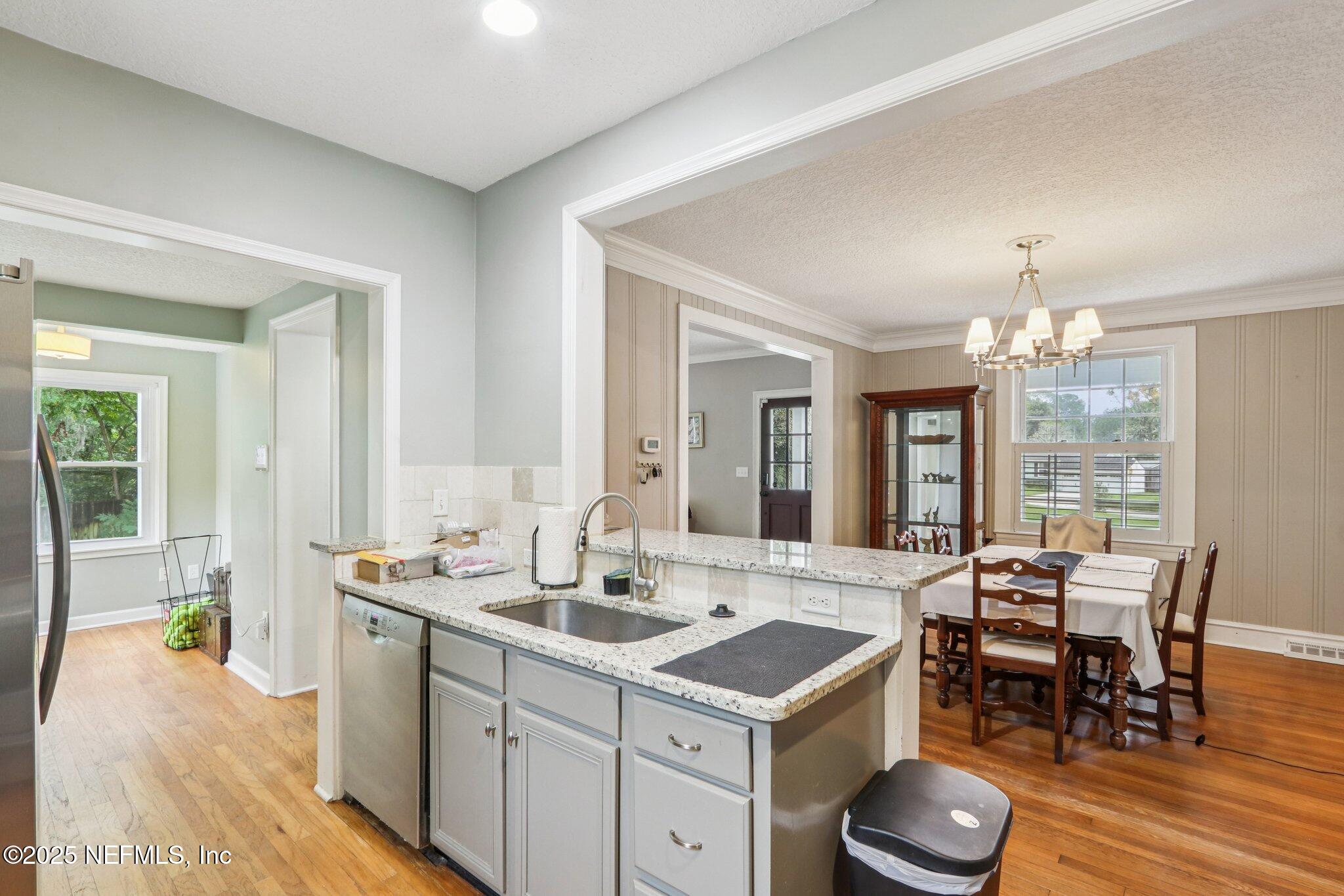 1605 Lorimier Road Jacksonville, FL 32207 - Photo 26 of 57 a view of a a dining room with furniture window and wooden floor