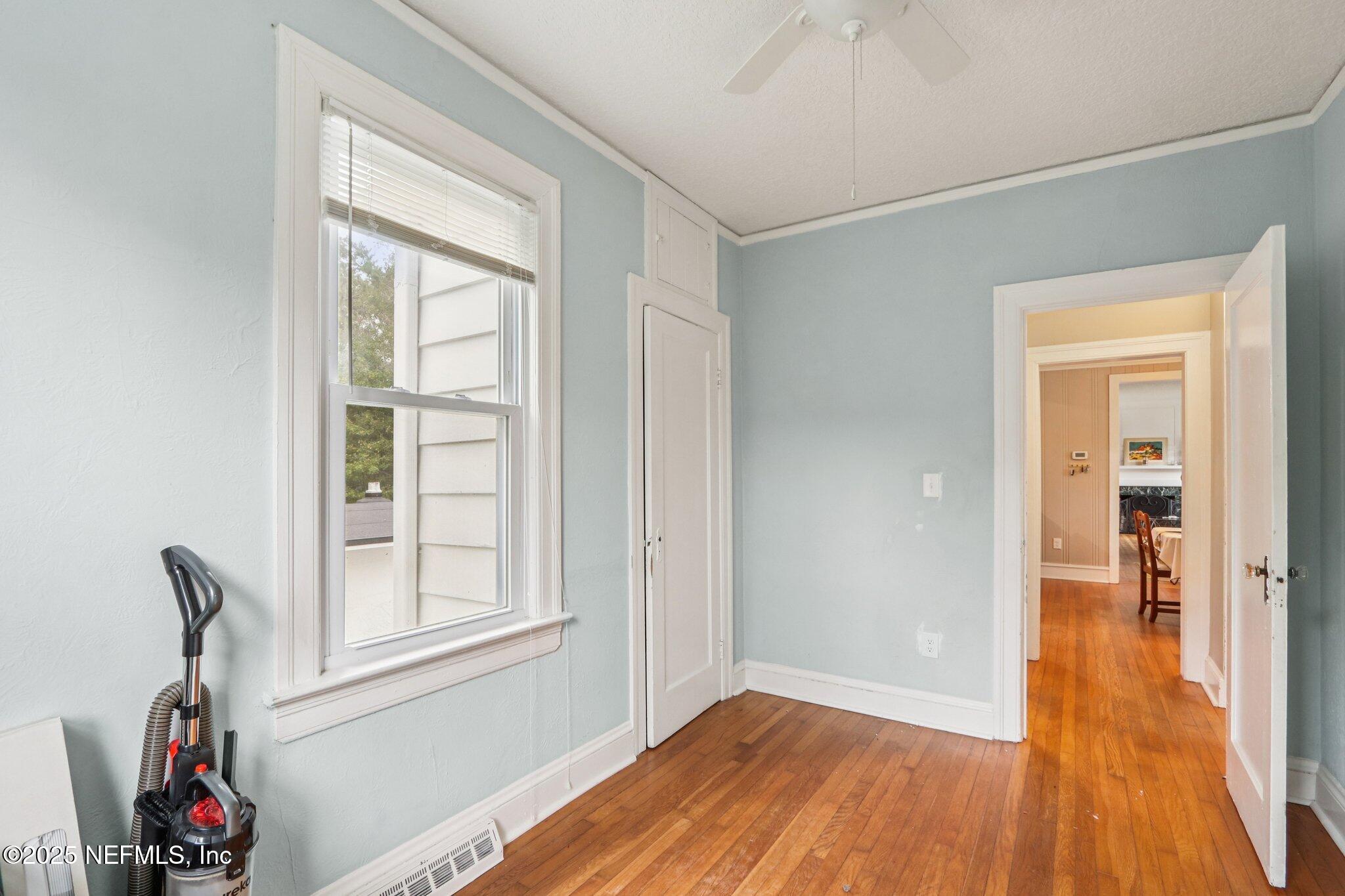 1605 Lorimier Road Jacksonville, FL 32207 - Photo 32 of 57 wooden floor in an empty room with a window