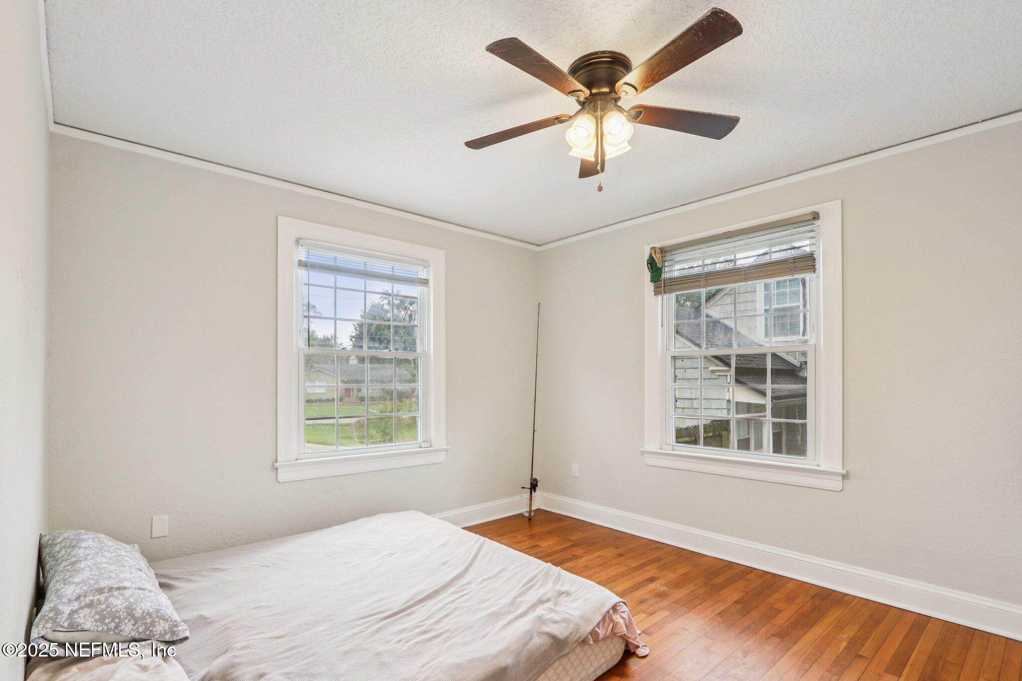 1605 Lorimier Road Jacksonville, FL 32207 - Photo 33 of 57 a bedroom with a large bed and a window