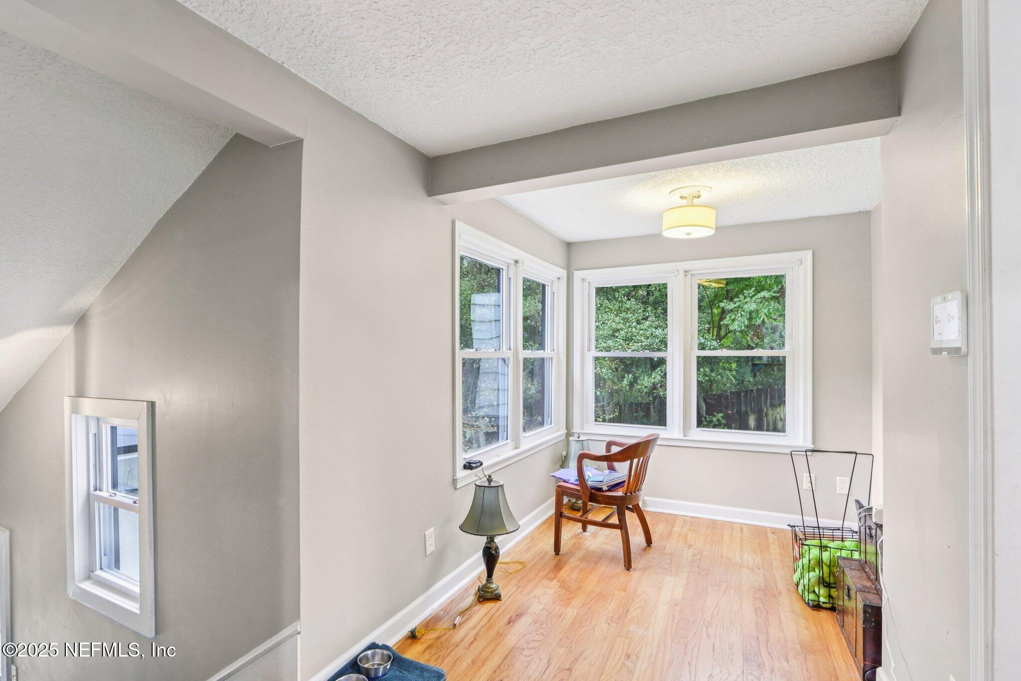 1605 Lorimier Road Jacksonville, FL 32207 - Photo 35 of 57 a living room filled with furniture and a wooden floor