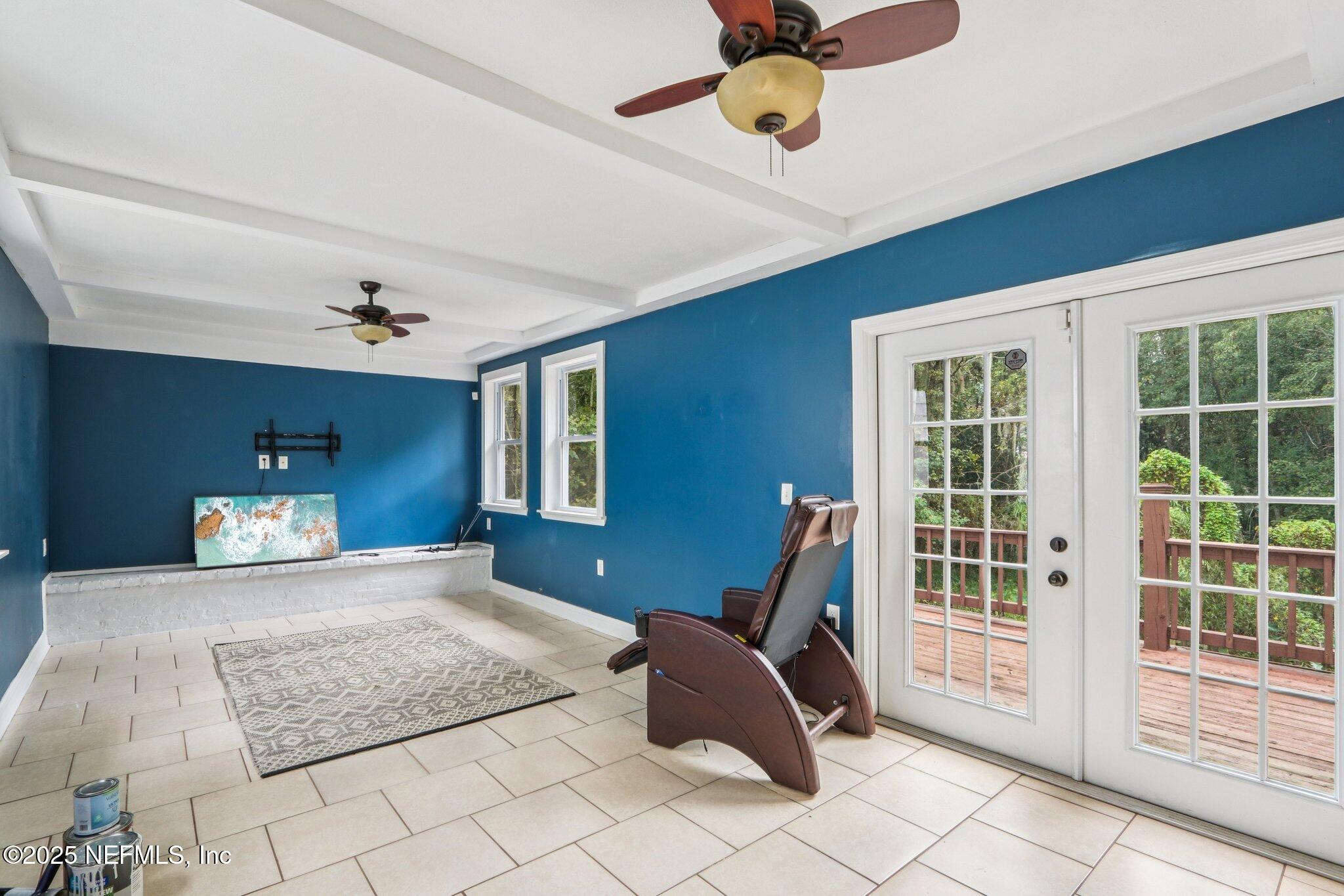1605 Lorimier Road Jacksonville, FL 32207 - Photo 43 of 57 a bedroom with a bed wooden floor and window