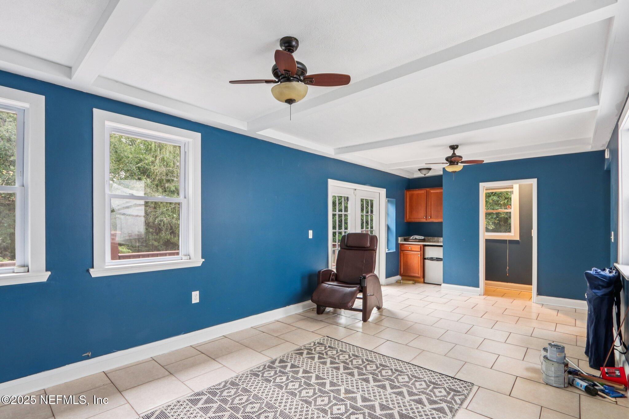 1605 Lorimier Road Jacksonville, FL 32207 - Photo 44 of 57 a living room with furniture and a flat screen tv