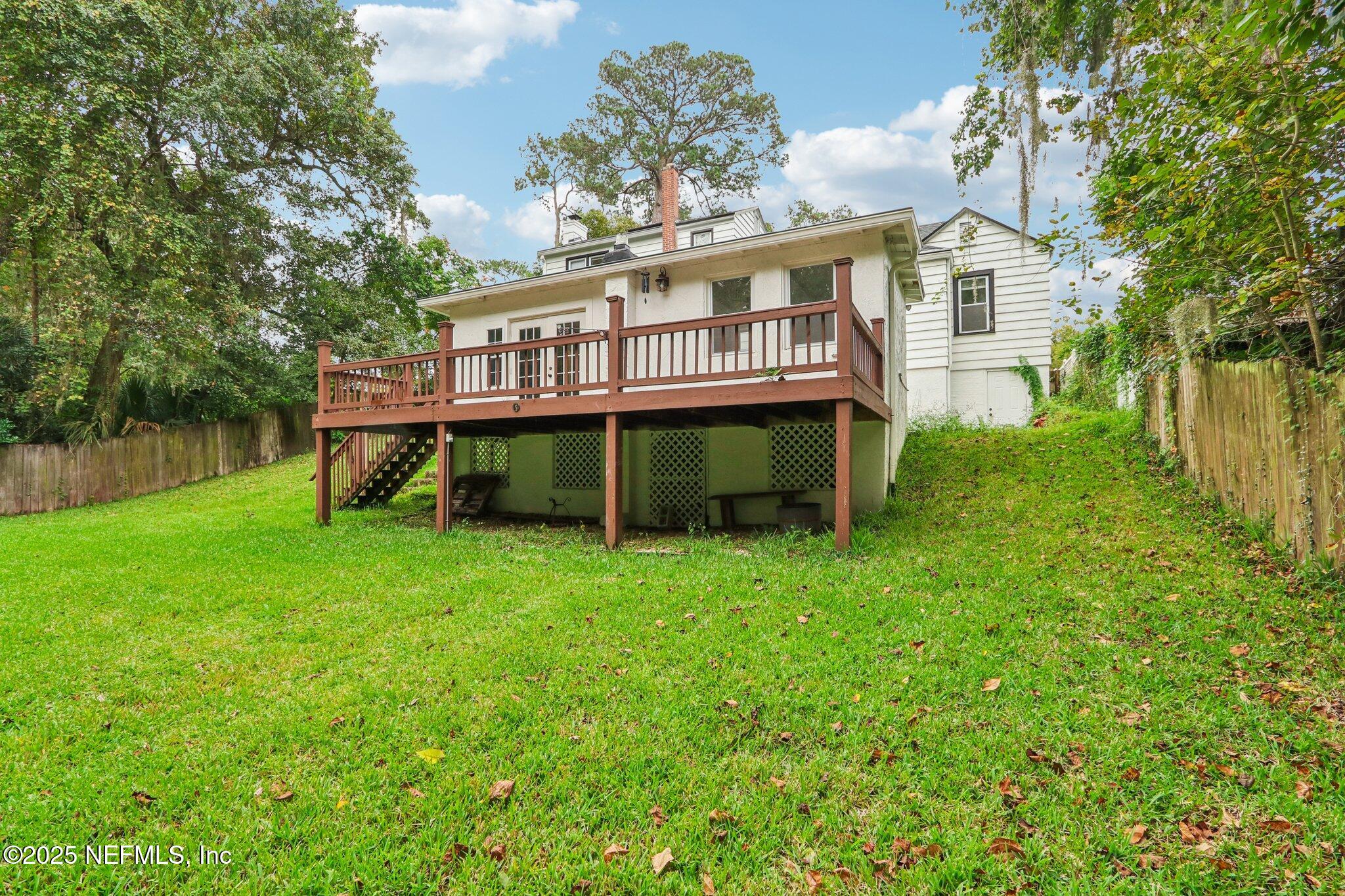 1605 Lorimier Road Jacksonville, FL 32207 - Photo 53 of 57 front view of a house with a yard and a deck