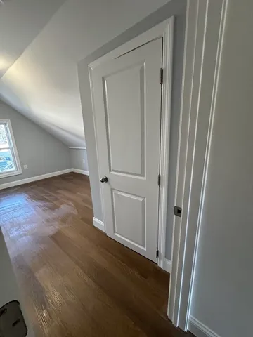 an entryway with wooden floor