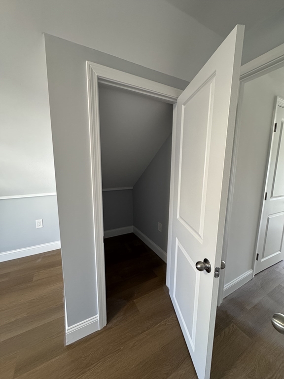 57 Ord Street Salem, MA 01970 - Photo 22 of 40 a view of a hallway with wooden floor and closet