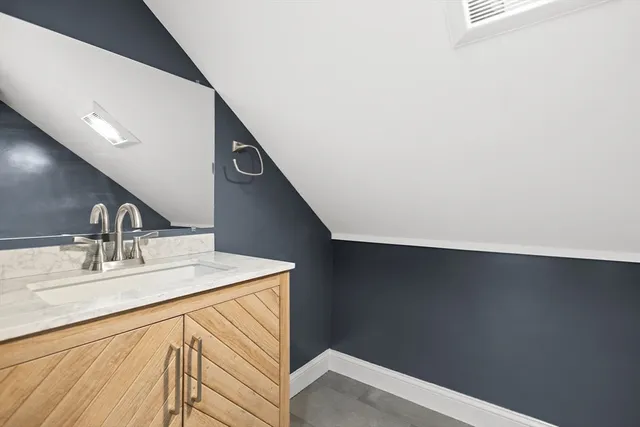 a kitchen with a sink and a refrigerator