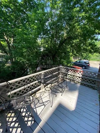 a view of a backyard with sitting area