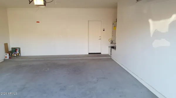 a backyard of a house with yard and tree