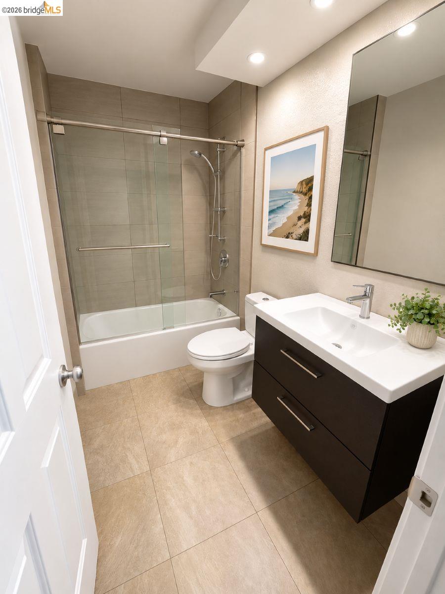 3623 Wells Road Oakley, CA 94561 - Photo 23 of 59 Floating vanity with integrated sink, tiled flooring, glass-enclosed shower/tub combination, recessed lighting, and a mirrored medicine cabinet