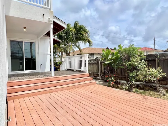 a view of an entryway with wooden floor and windows