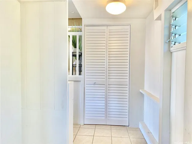 a kitchen with a sink cabinets and window